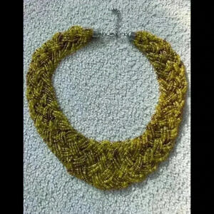 Beaded braided  bib necklace with yellow & bronze glass beads.